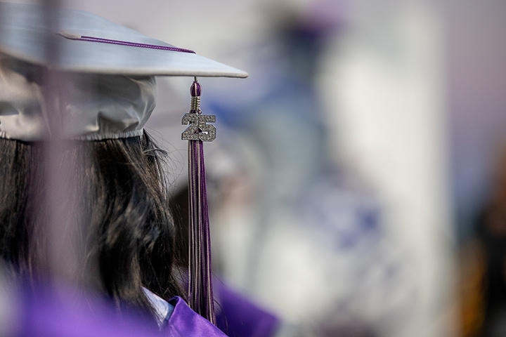 Closeup of a graduate's cap and 25 tassel