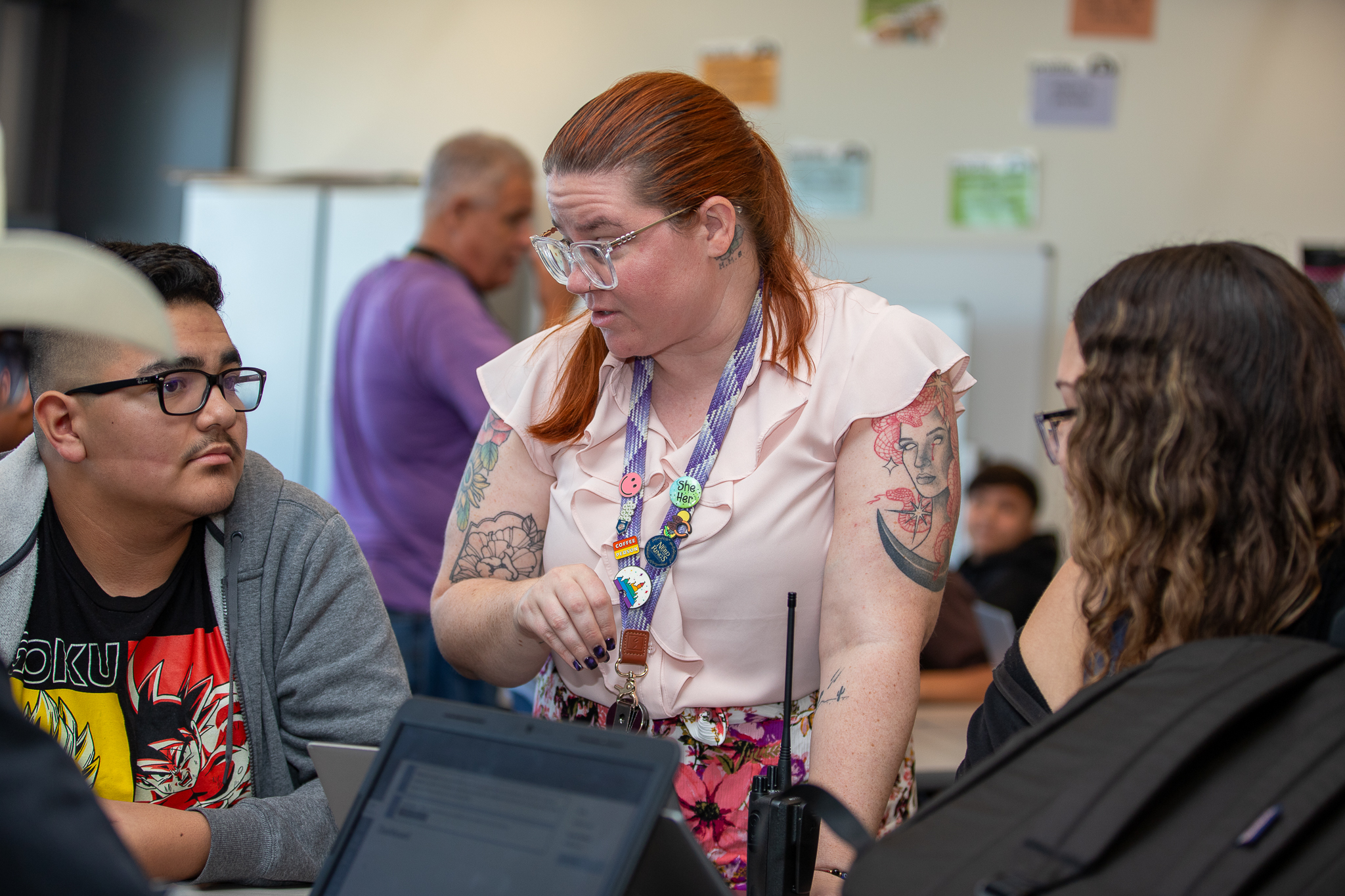 A teacher talks to her students
