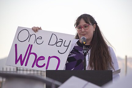 An InTech teacher holds up a sign that says One Day When